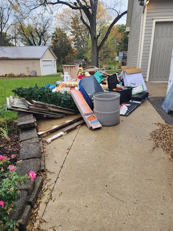 Dumpster being loaded with debris for Commercial Dumpster Rental in Socorro